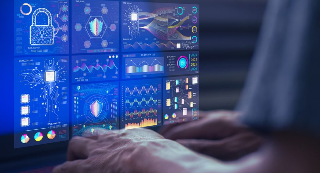 Mains sur laptop avec tableaux de bord analytics et graphiques de données pour data science