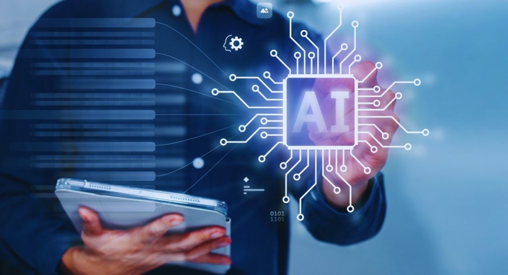 Professionnel en costume tenant une tablette et pointant une puce IA connectée